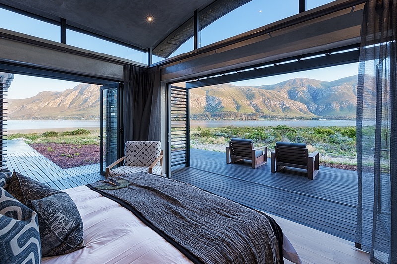 <p>BEDROOMS<br /> – Individually furnished rooms with views overlooking mountains, lagoon and Fynbos<br /> – Large foldaway doors that lead to private terraces with unobstructed Lagoon and mountain views<br /> – King size extra length beds which can be a turned into singles on request<br /> – En-suite bathrooms, bath & shower with underfloor heating<br /> – Eco pellet stoves<br /> – Ceiling fans<br /> – All rooms have a writing desk and Wi-Fi access points</p>